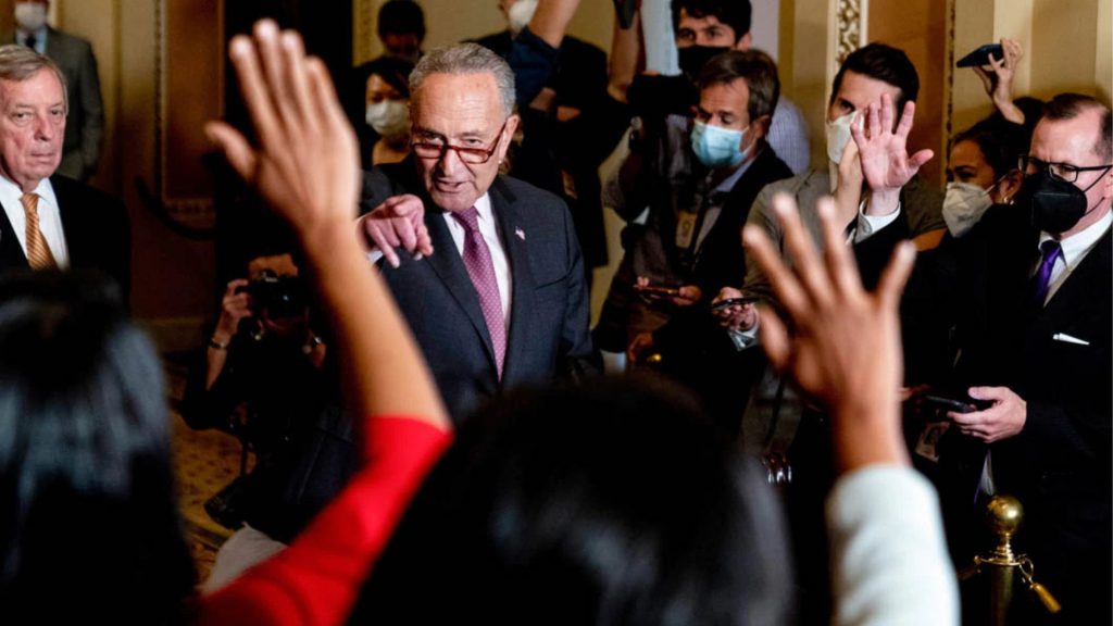 Politicians, such as then-Senate Majority Leader Chuck Schumer of New York (center), shown in 2021, are accustomed to fielding pointed questions from reporters. (© Andrew Harnik/AP Images)