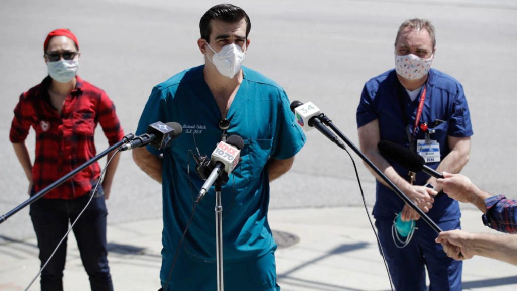 Health care professionals, such as these nurses in California in 2020, are important sources of information for reporters covering COVID-19-related events. (© Marcio Jose Sanchez/AP Images)